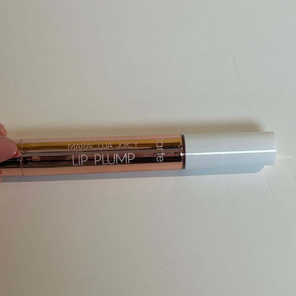 tarte Maracuja Juicy Lip Plump in Rosy Cooper shimmer glass
